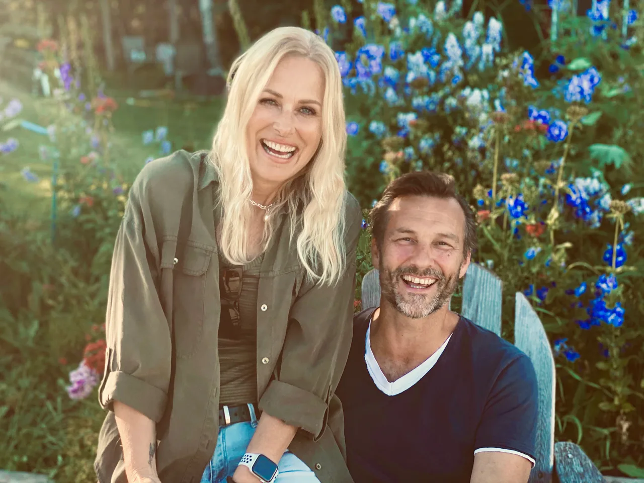 Jay and Cory Fiset smiling together in a garden